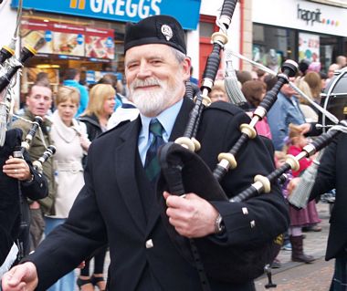 Bill Gallacher marching bagpipes band